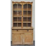Pine bookcase cabinet, with glazed doors to the top, width 108cm.