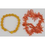 Amber coloured bead bracelet and a coral necklace, (2).