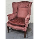 19th Century wing-back easy chair, upholstered in puce coloured sculptured dralon,