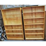 A pair of modern pine open bookcases, adjustable shelves, width 101cm (2).