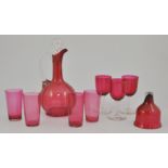 Cranberry glass decanter and stopper, 26cm, beakers and wine glasses, (9).