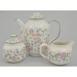 Royal Doulton teaset, "Autumn's Glory", a Poole Daisy pattern three-piece teaset,