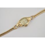 Lady's 9ct gold Tudor wristwatch, on a gold bracelet strap.