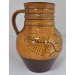 "Wells" terracotta glazed jug, 23cm, jar, two dishes and a bowl, (5).