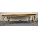 Large pine kitchen table, fixed top, turned legs, 243cm.