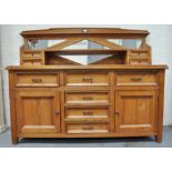 A Continental pine sideboard/dresser, centre column of 4 drawers flanked by cupboards, 180cm.