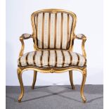 French gold painted fauteuil, scrolled arms, serpentine seat, cabriole legs, striped upholstery,