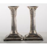 Pair of Victorian Corinthian column table candlesticks, (damaged), weighted.