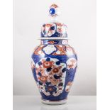 Pair of Japanese Imari baluster vases and covers, 42cms and a similar vase, 30cms, (3).