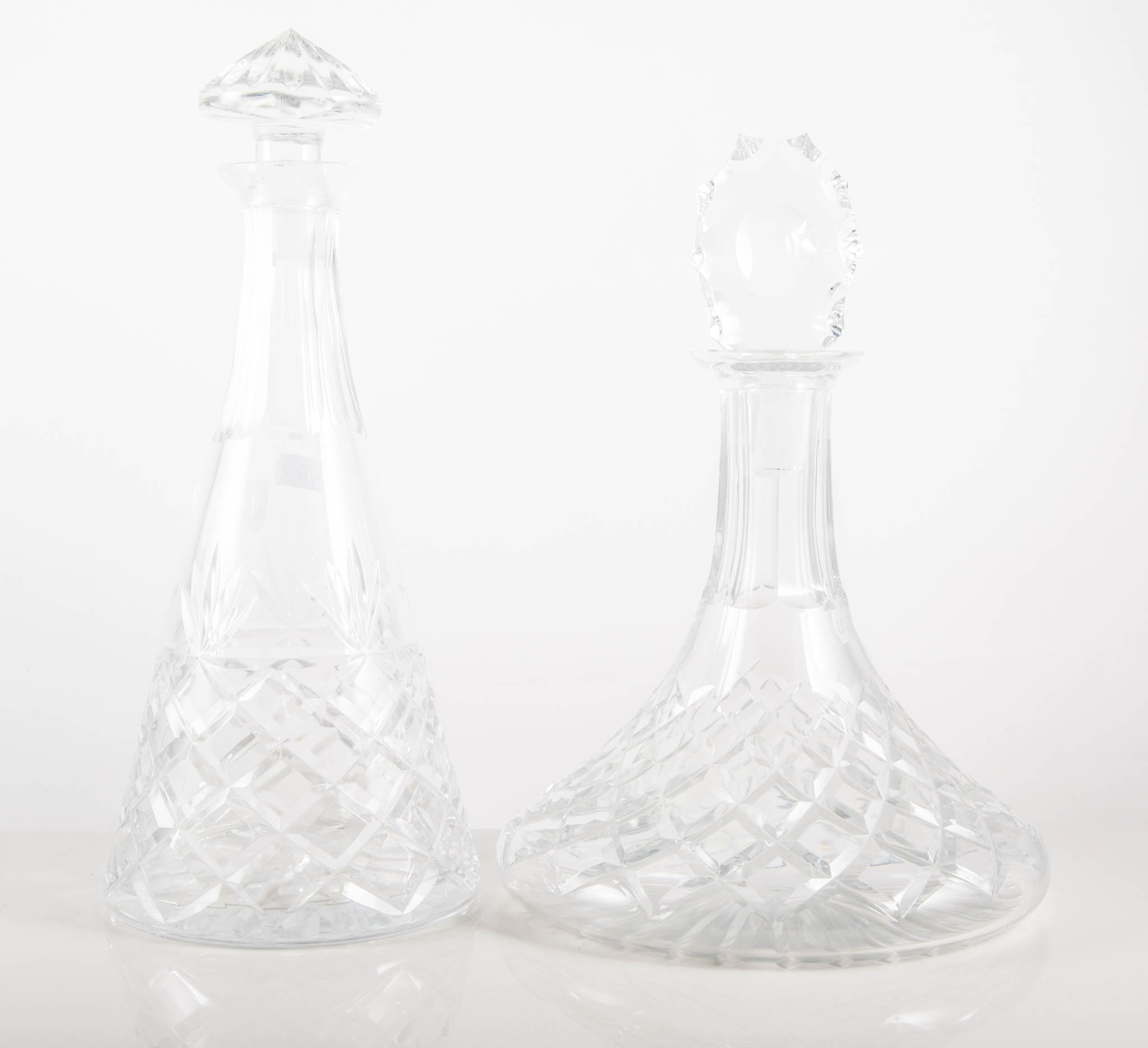 Cut glass ships decanter with stopper, height 28cm, another ships decanter and a tapering decanter,
