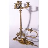 Gilt metal three-light candelabra, paw feet,