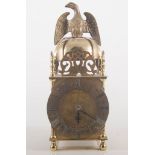 Modern lantern clock, eagle finial, circular chapter ring, musical movement, height 27cm.