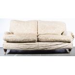 Pair of Multiyork sofas, champagne coloured scrolled upholstery, turned legs, length 190cm,