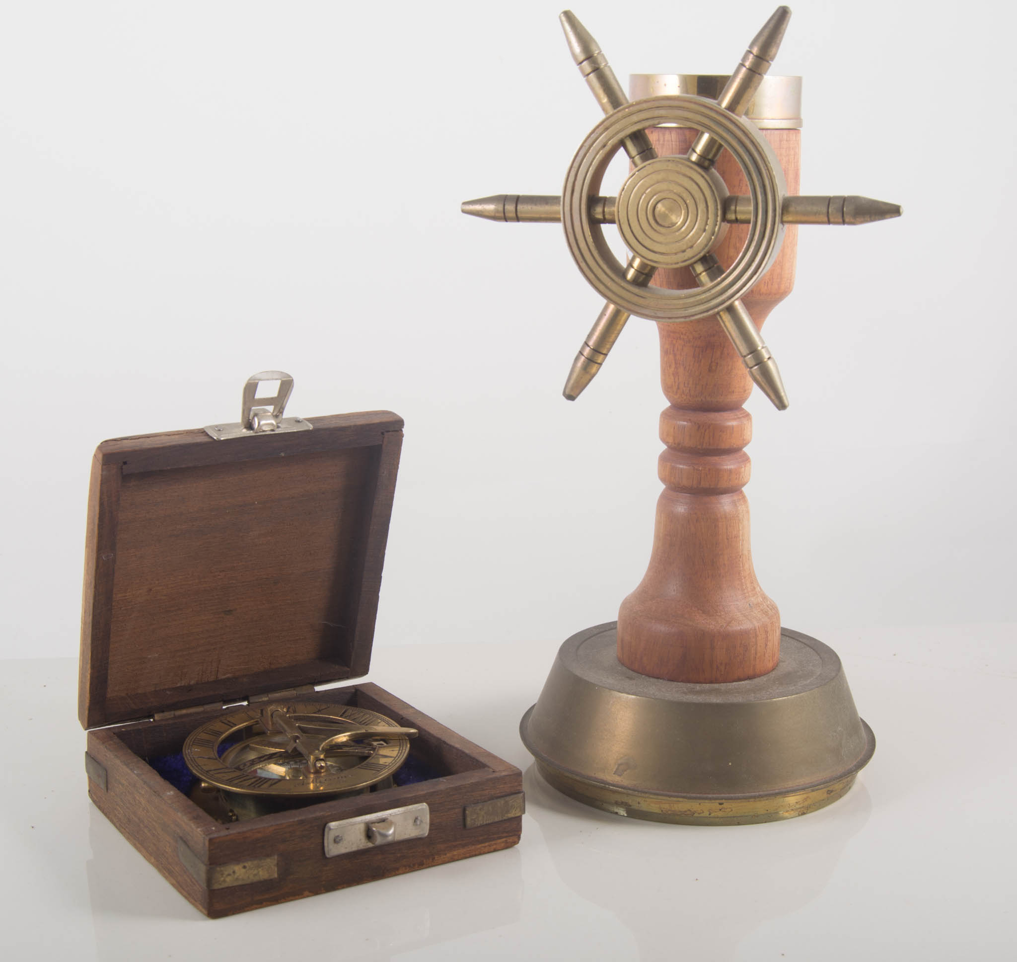 Re-cast brass sextant, another boxed compass, table compass, gimballed led compass.