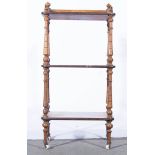 Victorian walnut three tier whatnot, the upper section with a three-quarter gallery and supports,