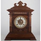 American walnut shelf clock, circular dial, leather case with bracket feet, height 44cm.