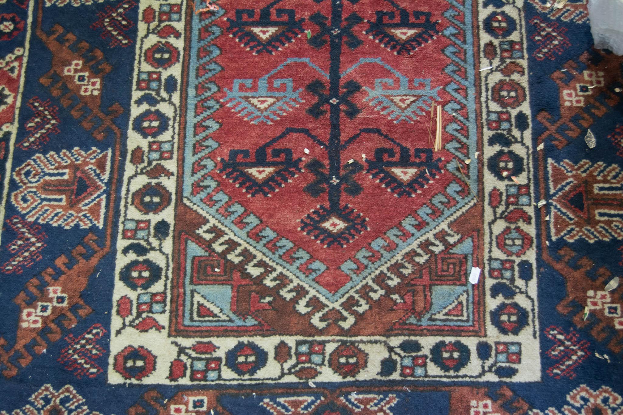 Caucasian rug, central lozenge medallion on a pole, red field, border within guards, - Image 2 of 2