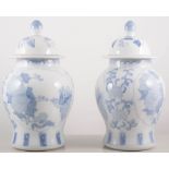 Pair of modern Chinese blue and white baluster vases with covers, height 28cm,