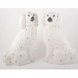 A pair of Staffordshire pottery models of King Charles Spaniels, height 39.5cms.