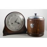 Oak mantel clock, height 20cm, pair of oak candlesticks and an oak biscuit barrel, (4).
