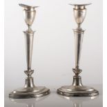 Pair of silver candlesticks, urn shaped sconces, engraved initials W&S London 1910, 24cm, weighted.