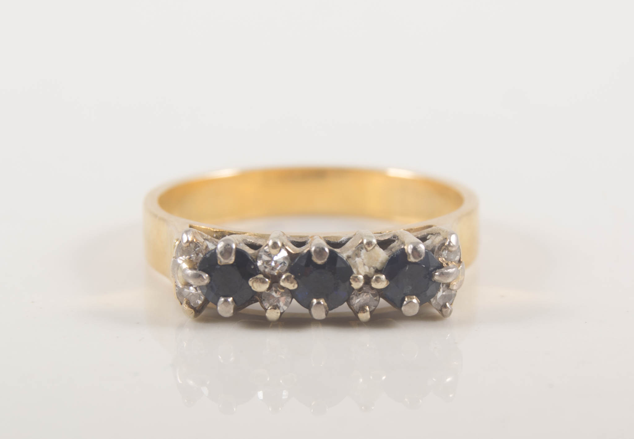 A sapphire and diamond modern half hoop ring, sapphires (3),