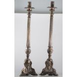 Pair of plated tall altar candlesticks, reeded columns and triform bases, height 71cm.