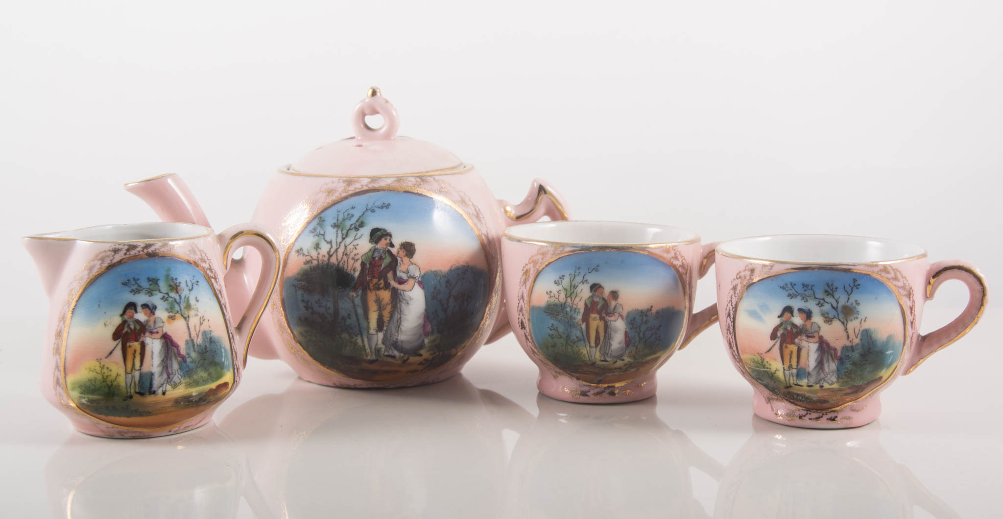 Fairing china toy teaset, pink ground, printed decoration.