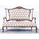 Edwardian mahogany framed sofa, carved a scrolled back, shaped arms, serpentine seat, cabriole legs,