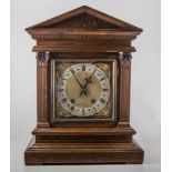 Edwardian walnut mantel clock, architectural case, striking on a gong, 41cm.