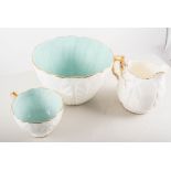 Staffordshire bone china tea set, leaf moulded, gilt outlines, and turquoise lined.