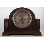 Oak cased mantel clock, foreign movement, striking on nine gongs, height 23.5cms.