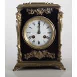 French ebonised and gilt metal mantel clock, cast caryatid figures to the angles,