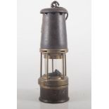 A Miner's lamp, GMEF, stamped Sheffield, height 29cms.
