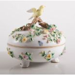 Continental porcelain box and cover, with applied branches and leaves,