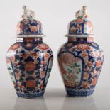 Pair of Imari covered vases of baluster form, floral decoration, 29cm, and two Imari dishes, (4).