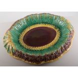 A Majolica bread plate, moulded border, 33cm.