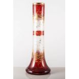 Ruby overlaid and enamelled vase, decorated with floral sprigs, flared base, height 31cms.