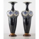 Pair of Doulton Lambeth baluster vases, embossed shoulders (one foot restored), height 25.5cms.