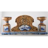 Three piece Continental faience pottery clock garniture, marble effect,