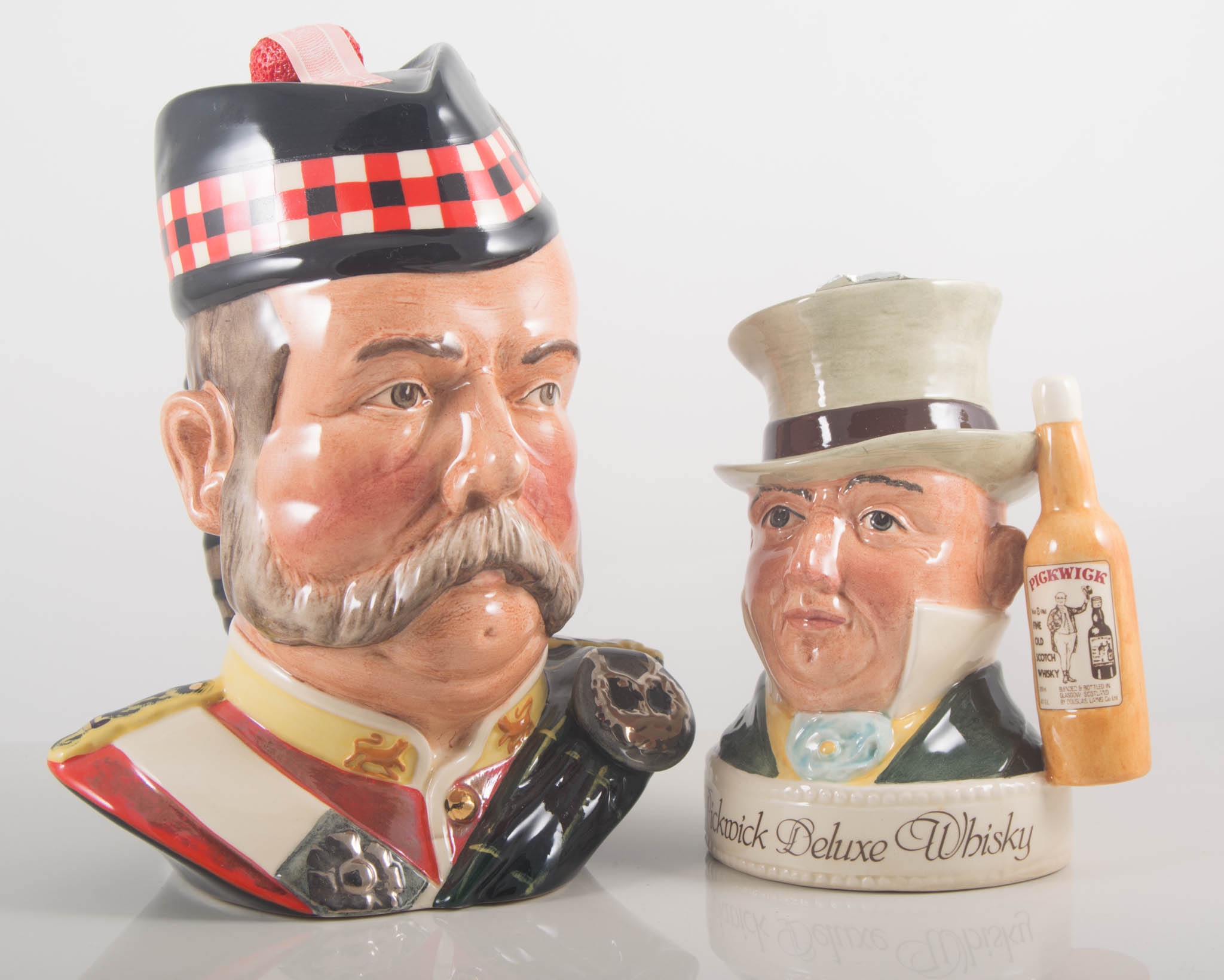 Royal Doulton Grants character flask, boxed, and Pickwick flask and Grants flask, (3).