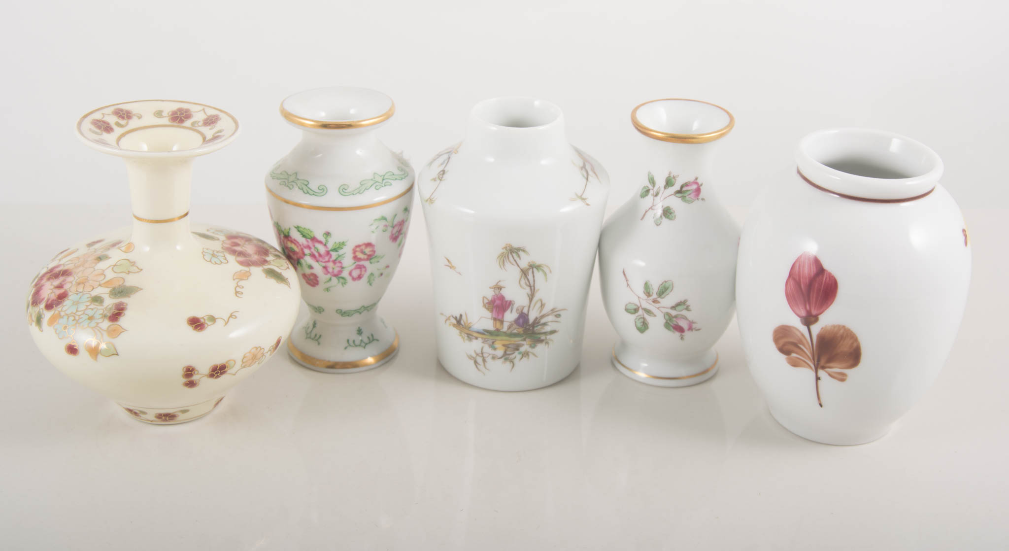 Three wall shelf units, with decorative porcelain.