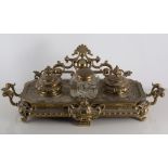 Brass desk stand with removable twin inkwells, 43cm wide,