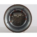 Brass-cased barometer, engraved dial, diameter 14cm, together with a glass pressure bottle.