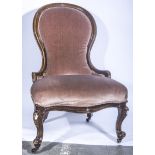 Victorian nursing chair, upholstered buttoned salmon brocade, turned walnut legs, 72cm.