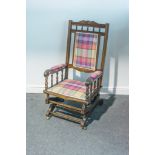 Mahogany framed American style rocking chair, turned spindles to top and sides,