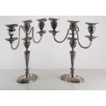 Pair of Edwardian silver-plated three-light table candelabra, neo-classical style, oval bases,