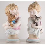 Pair of Austrian biscuit glazed half-length figures, of a boy with his dog and a girl with her cat,