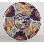 Chinese polychrome dish, shallow circular form, decorated with women by a riverside, restored,
