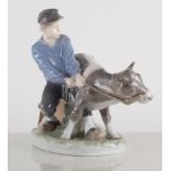Royal Copenhagen model of a boy with a calf, No. 772, 18cm.